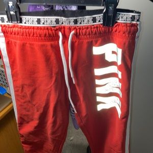 Victoria secret/PINK - size small, red joggers with white stripe and a pink logo